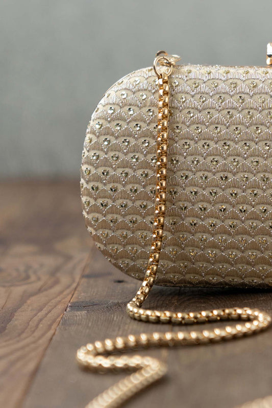 AMYRA - Champagne Capsule Clutch