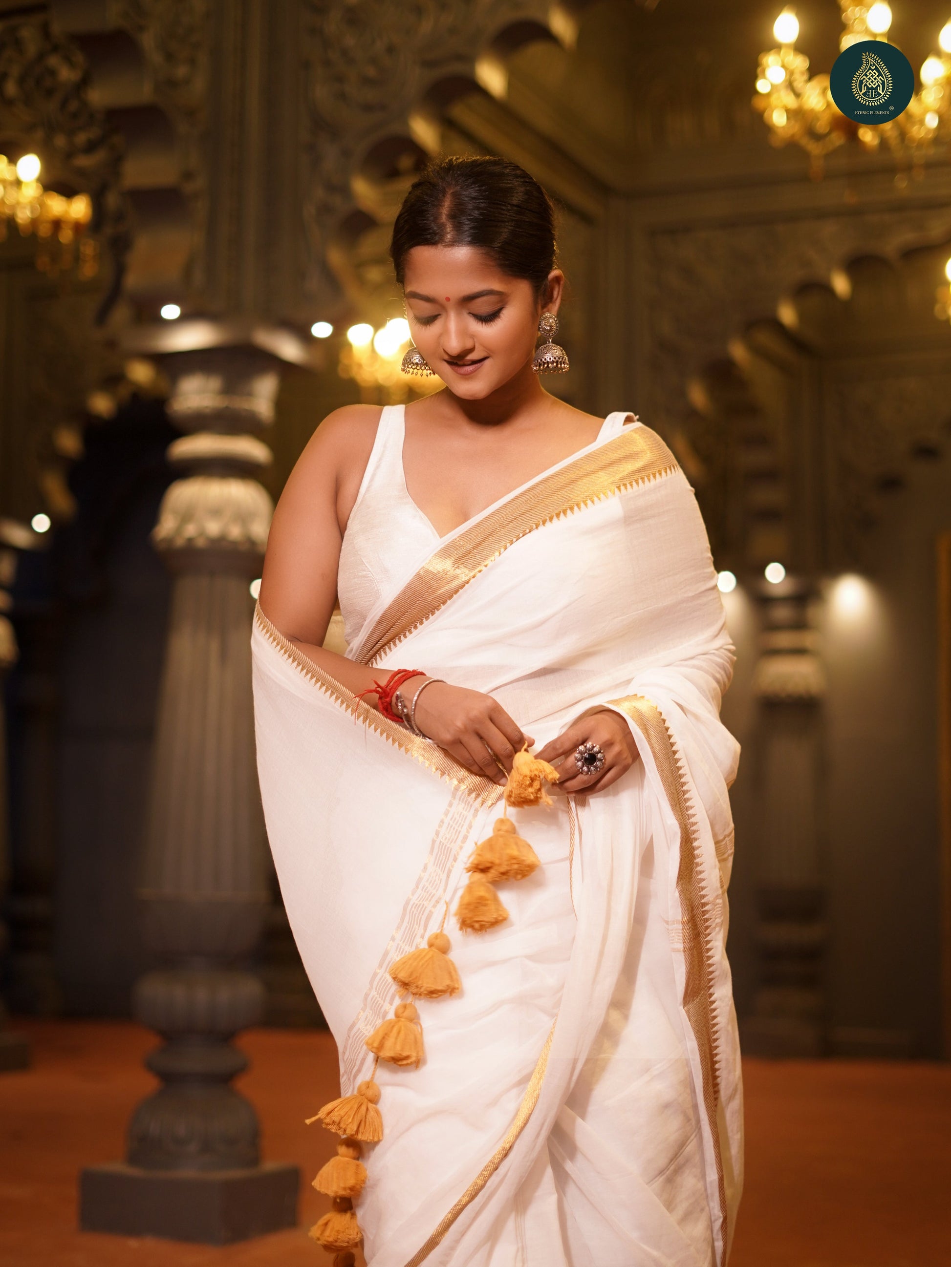 Coco White Thiruvonam Mul Cotton Solid Saree