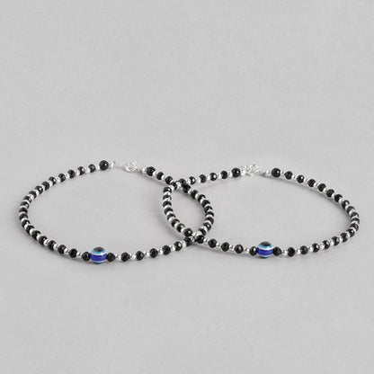 Two 925 Sterling Silver anklets for women featuring black beads and a blue evil eye. Fine jewellery – Zavya