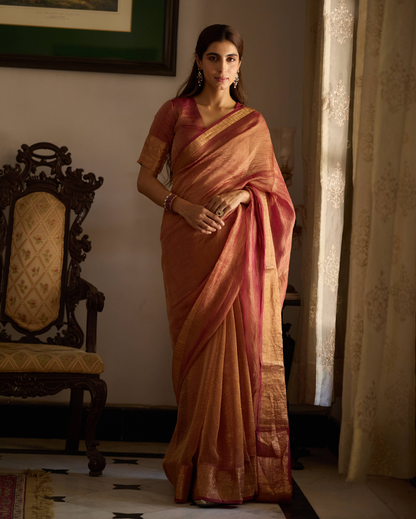 Mṛdula Brick Red Solid Crushed Tissue Saree