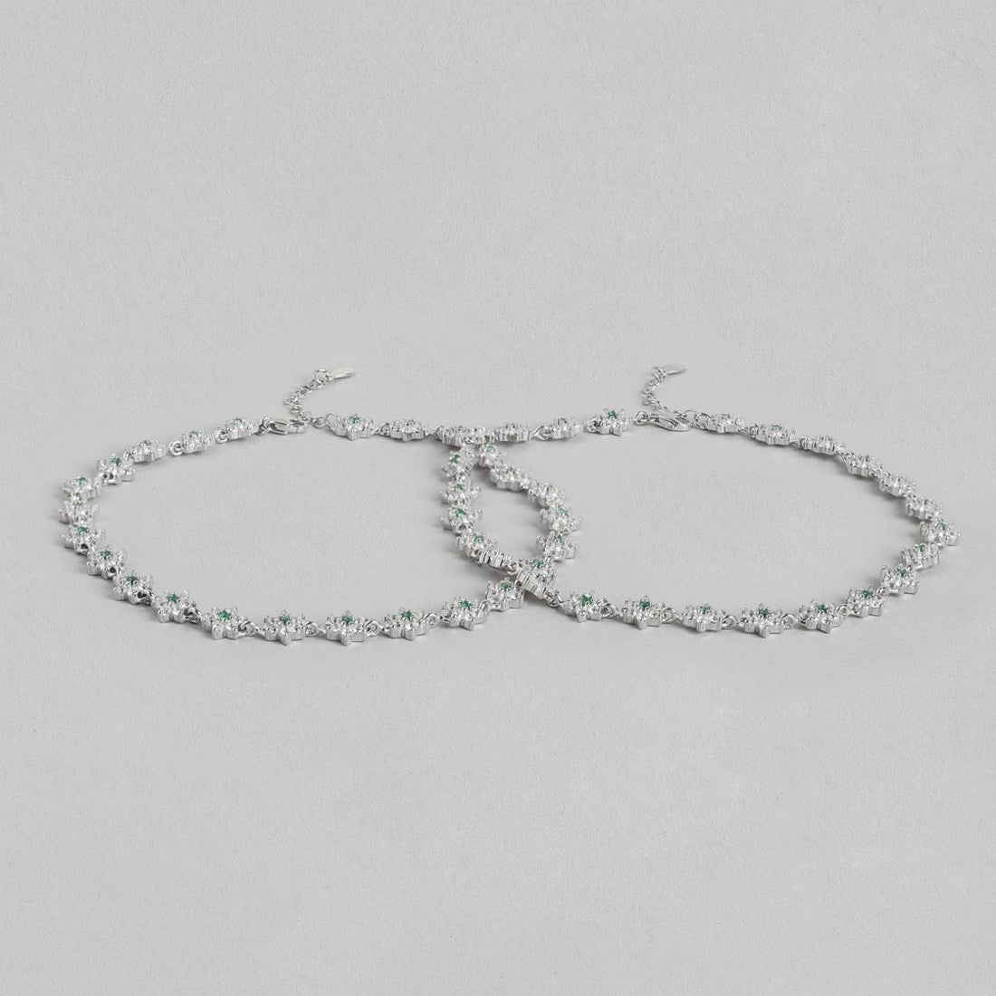 Women's floral 925 Sterling Silver anklet pair with green CZ stones. Elegant fine jewellery – Zavya