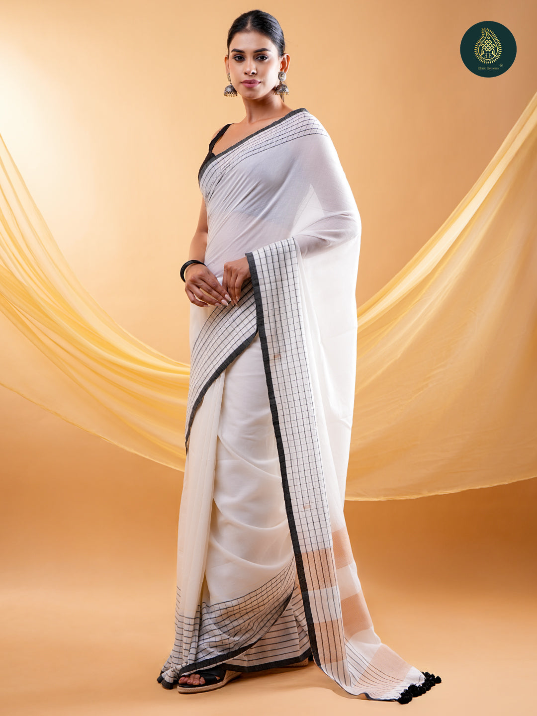 Chic White -  Mul Cotton Saree with Grid Border & Tassels