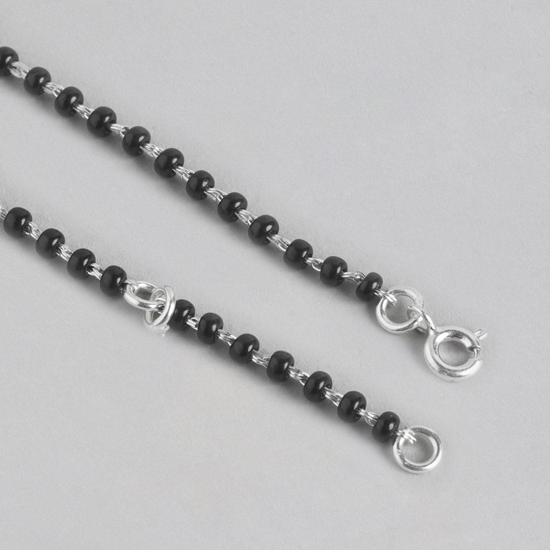 Women's 925 Sterling Silver anklet featuring black beads on a delicate silver chain with clasp – Zavya