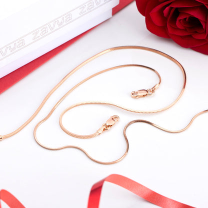 Golden 925 Sterling Silver snake chain anklet for women beside a red rose and white gift box. – Zavya