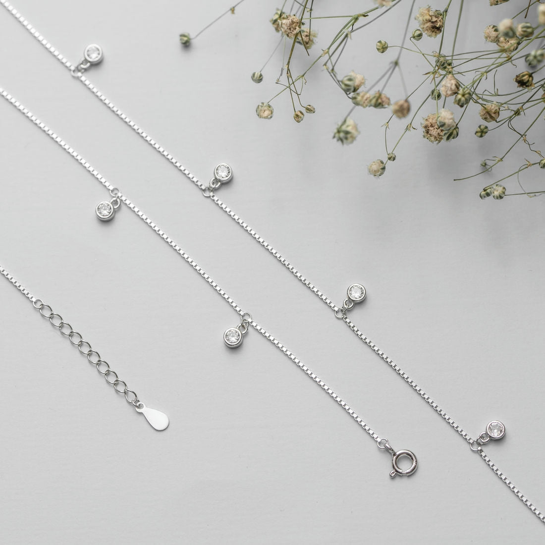 Women's 925 Sterling Silver anklet featuring a delicate chain with clear drop CZ stones and clasp – Zavya