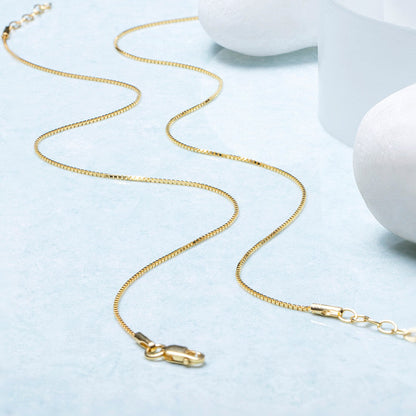 Everyday gold-plated 925 Sterling Silver box chain anklet for women on a light blue surface – Zavya