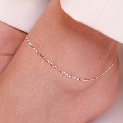 Minimal triple tone figaro chain 925 sterling silver anklet delicately worn on a woman's ankle. – Zavya