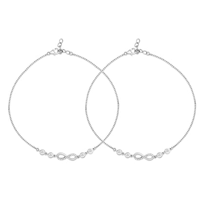 Two elegant women's 925 Sterling Silver anklets featuring sparkling crystal infinity charms. – Zavya