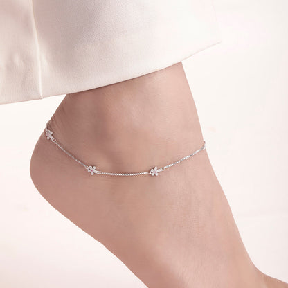 Woman wearing a delicate floral 925 Sterling Silver anklet. Beautiful women's jewellery – Zavya