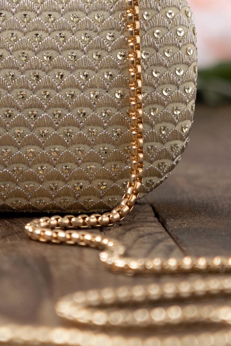 AMYRA - Champagne Capsule Clutch