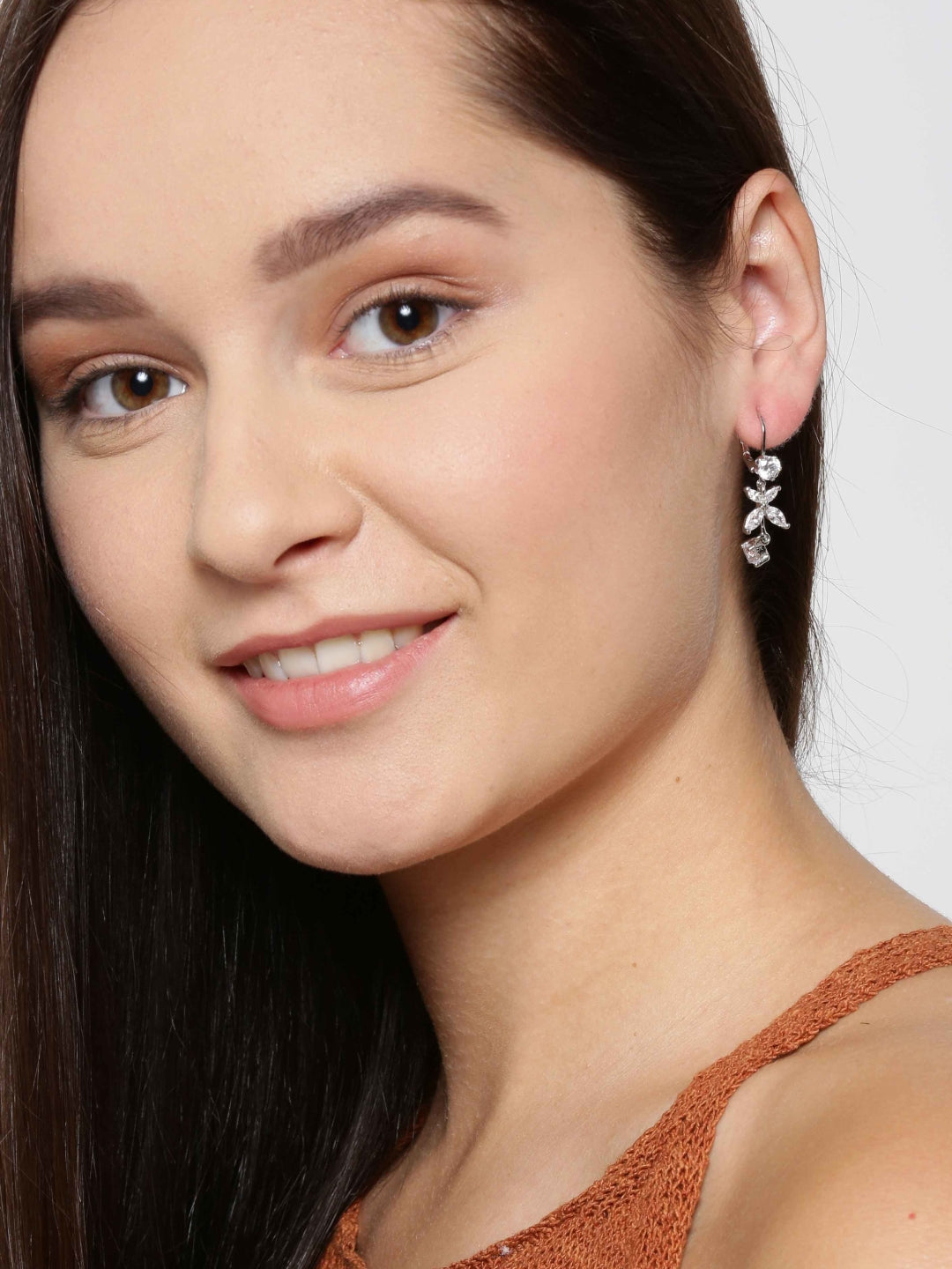 Silver Plated American Diamond Studded Floral Pattern Drop Earrings For Women
