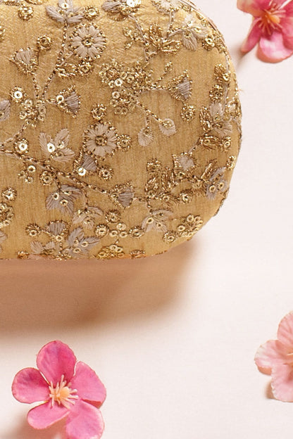 AMYRA - Elan gold capsule clutch