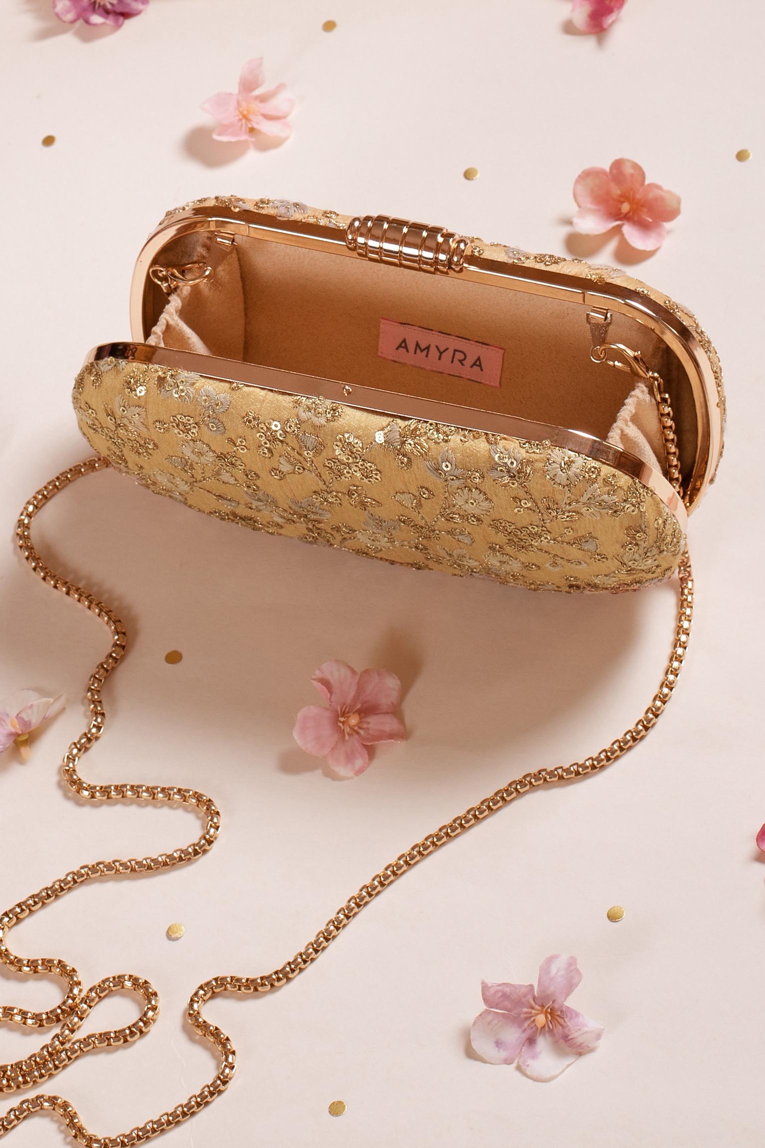 AMYRA - Elan gold capsule clutch