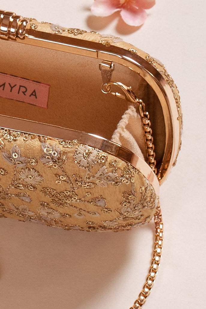AMYRA - Elan gold capsule clutch