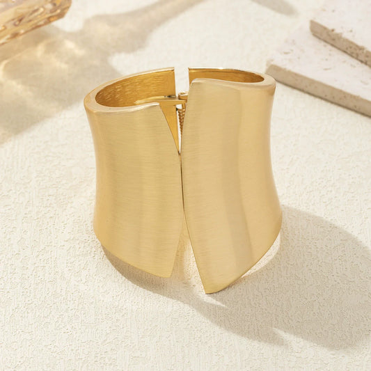 Just Lil Things Gold-Tone Flared Cuff Bracelet with Modern Design JLTB0946