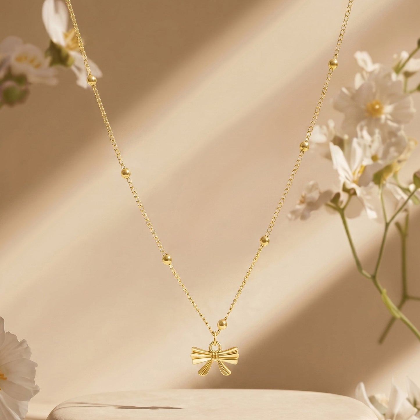 Cici Bow-Styled Gold Love Necklace