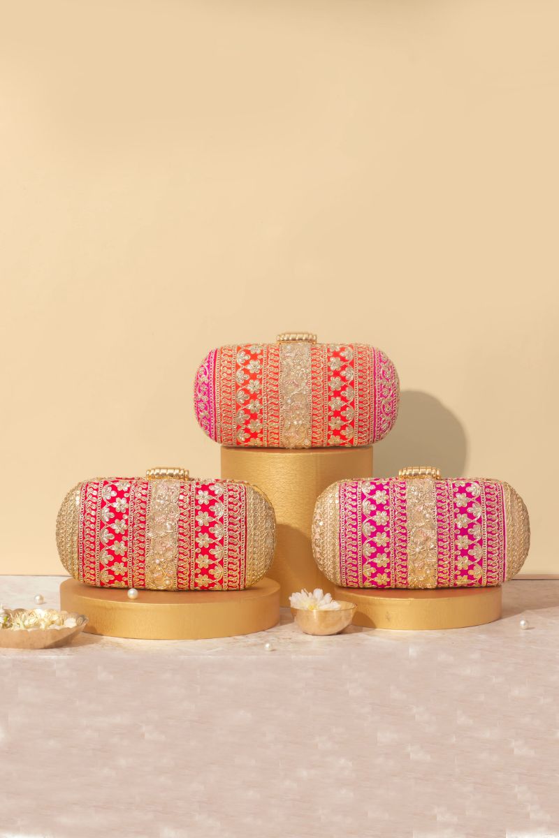 AMYRA - Naaz Capsule clutch - Orange and Pink