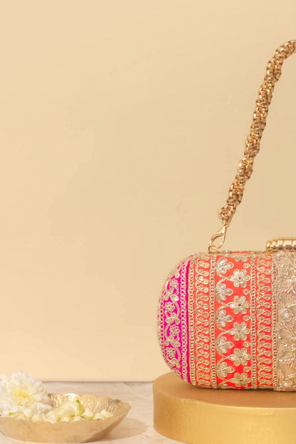 AMYRA - Naaz Capsule clutch - Orange and Pink