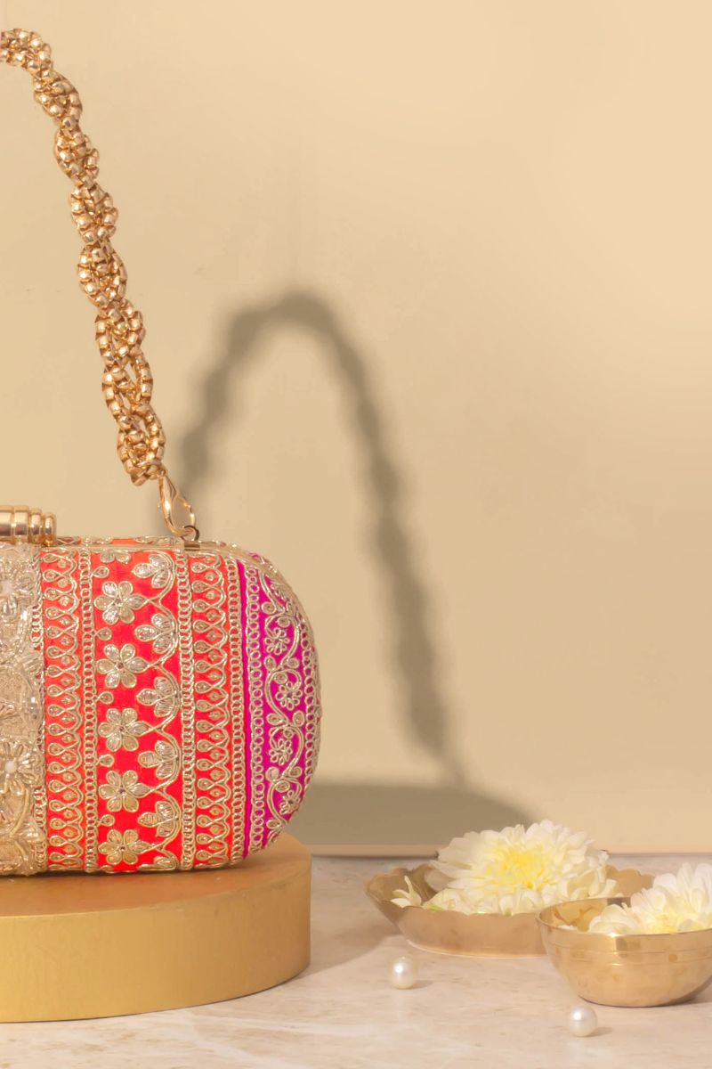 AMYRA - Naaz Capsule clutch - Orange and Pink