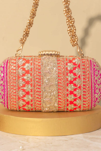 AMYRA - Naaz Capsule clutch - Orange and Pink