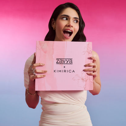 Excited woman holding Kimirica x Zavya hamper, wearing 925 Sterling Silver rings. Jewellery gift for women – Zavya