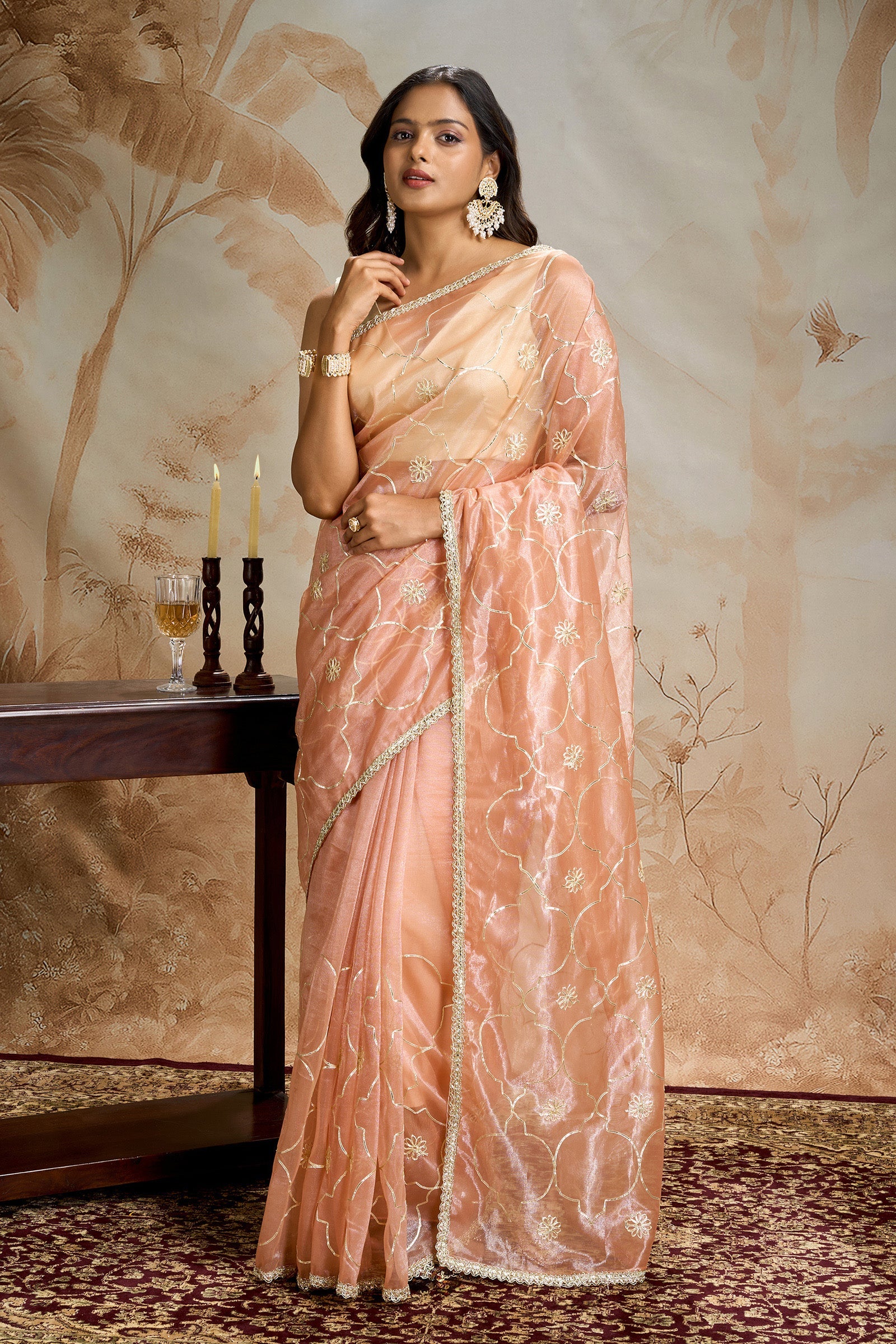 Teejh Hriya Peach Orange Net Gota Saree