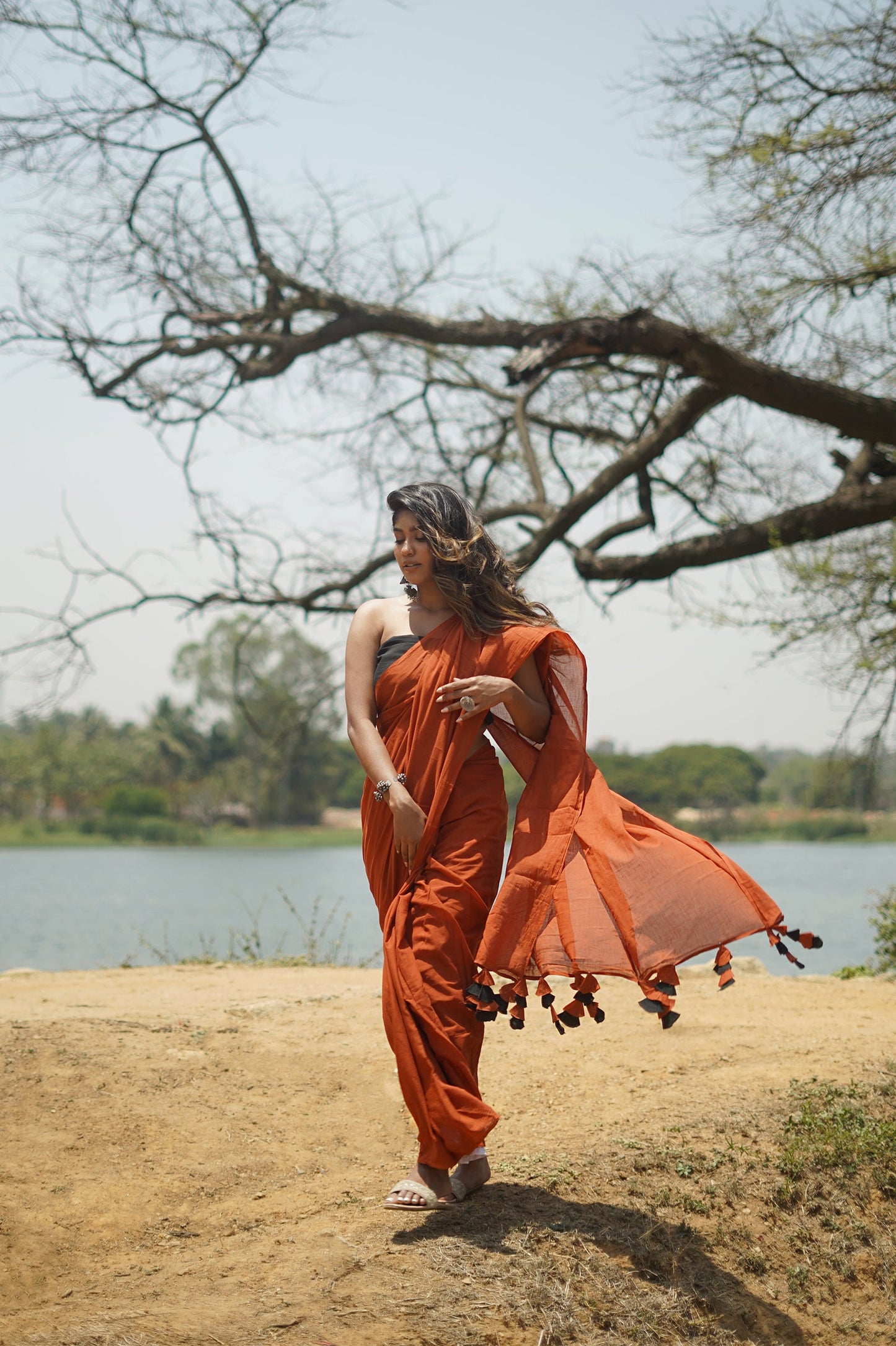 Teejh Dusk and Dawn Rust Orange  and Black Mulmul Saree