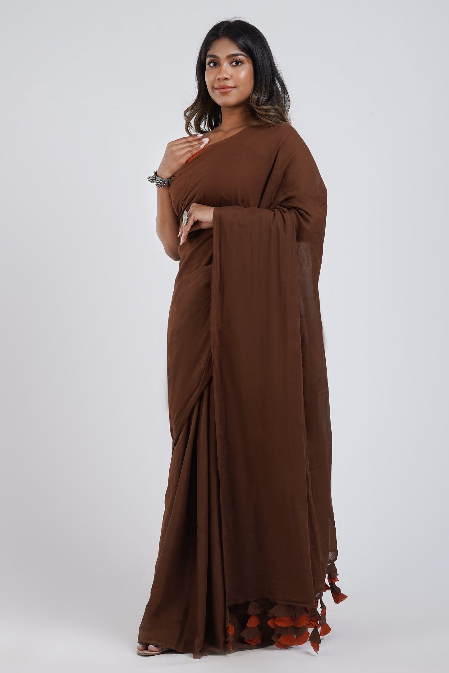 Teejh Sun and Saturn Brown and Rust Orange Mulmul Saree