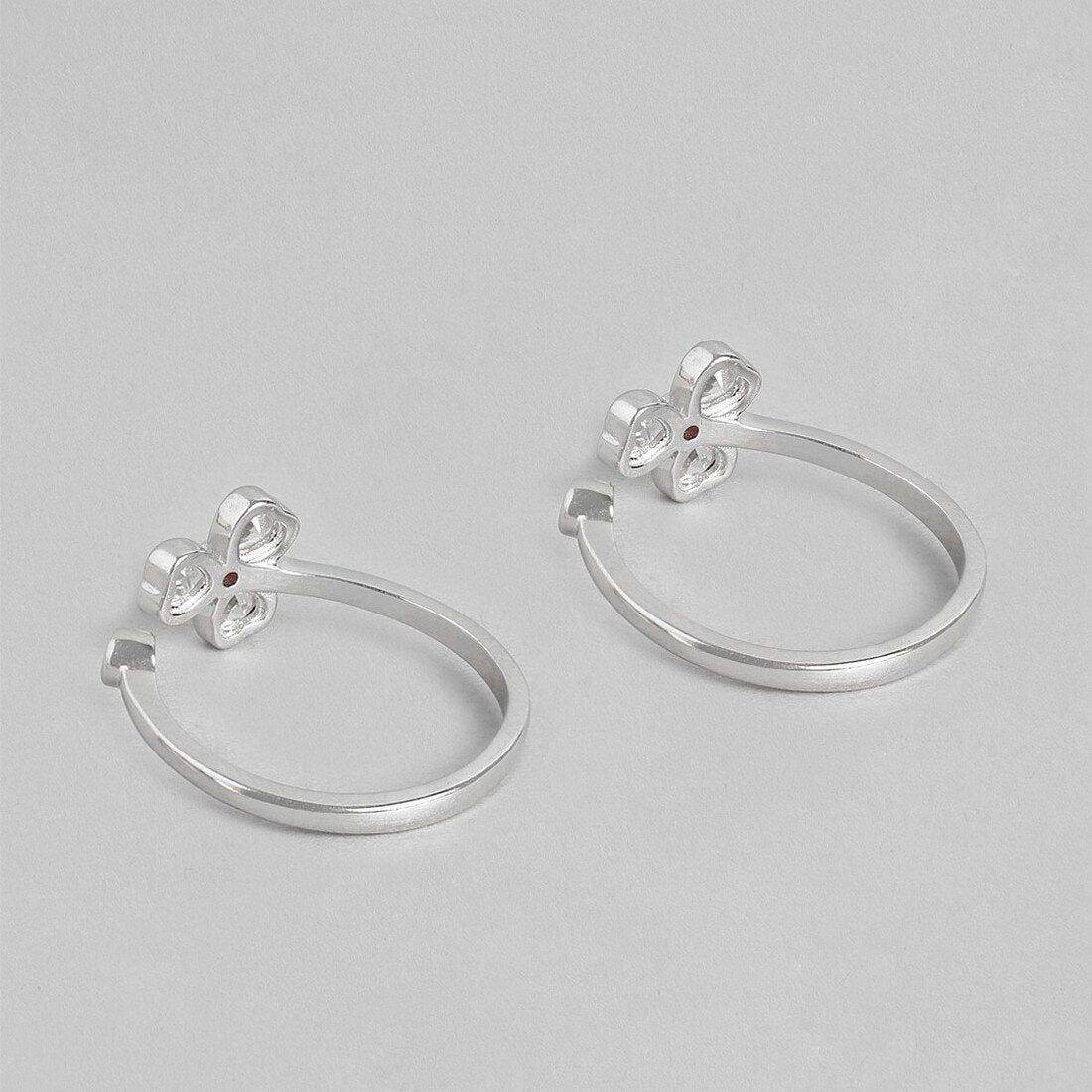 Two tiny floral 925 Sterling Silver adjustable toe rings for women showing open bands – Zavya