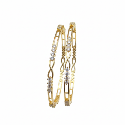 Gold bangles on white background