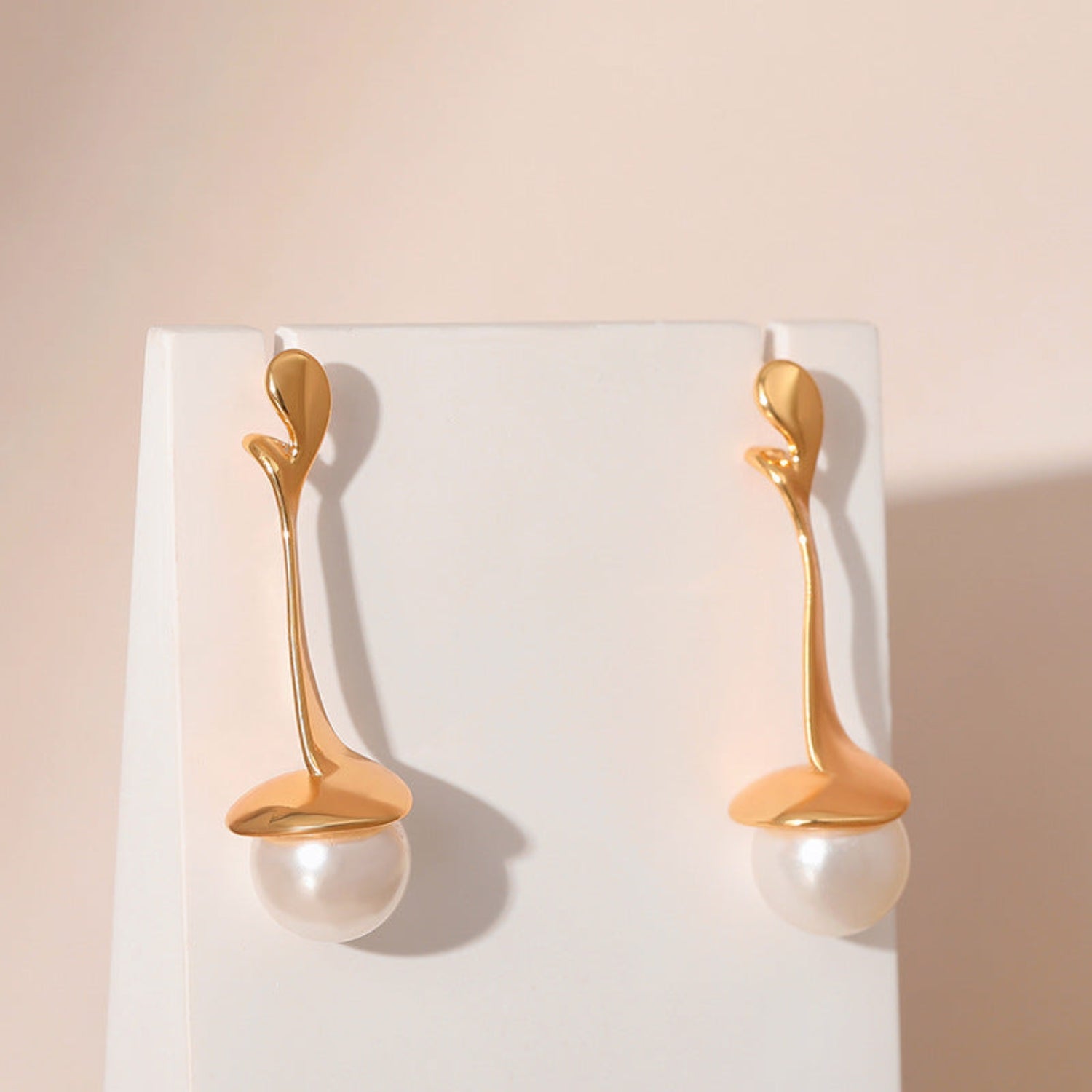 Gold Fluid Pearl Drop Stud earrings JLT12337