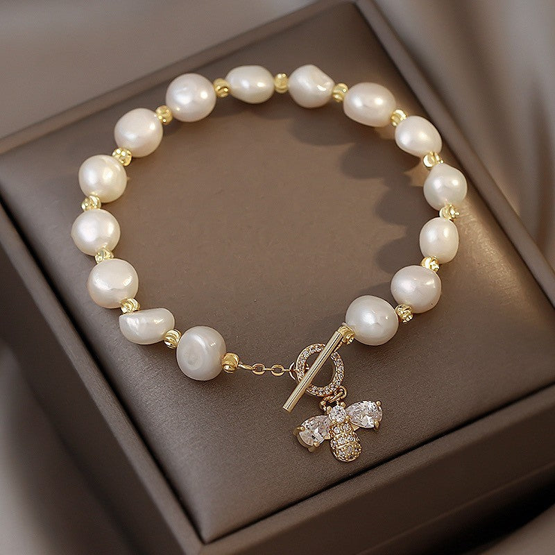Just Lil Things Artificial Elegant Pearl Bracelet with Gold Bee Charm – Chic & Timeless Design JLTB0386