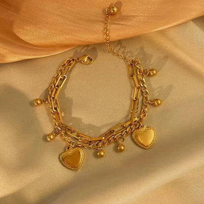 Just Lil Things Artificial Golden Heart Charm Bracelet & Link Chain Duo – Elegant Layered Set    Bracelets