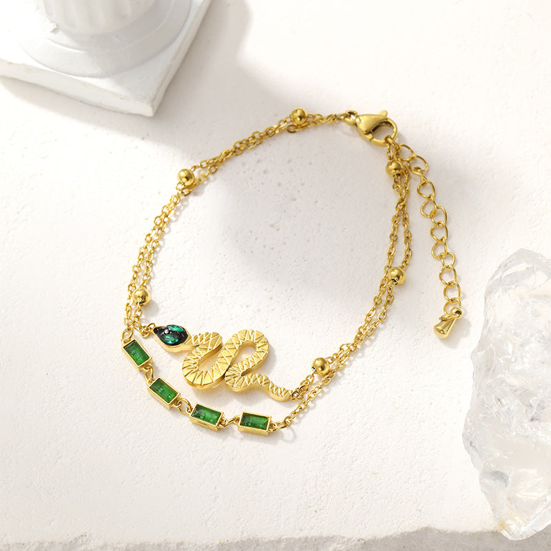 Serpent Charm Bracelet with Green Gem Accents – Dual Layer Gold Chain JLTB0547