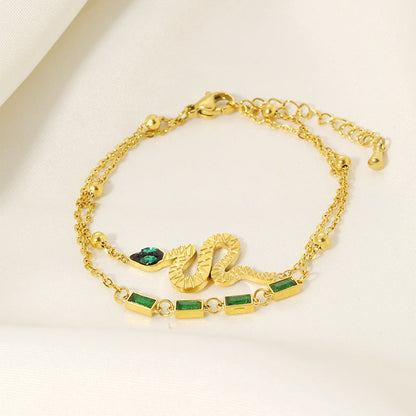 Serpent Charm Bracelet with Green Gem Accents – Dual Layer Gold Chain JLTB0547