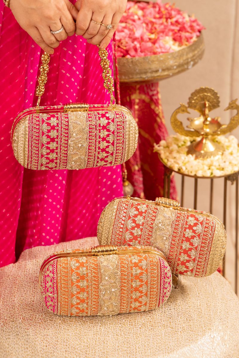 AMYRA - Naaz Capsule clutch - Red and Gold