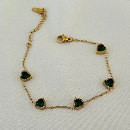 Gold bracelet with green heart-shaped stones