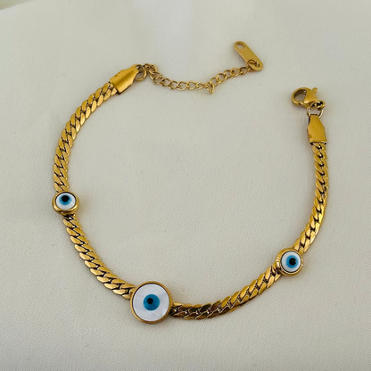 Gold bracelet with blue evil eye charms