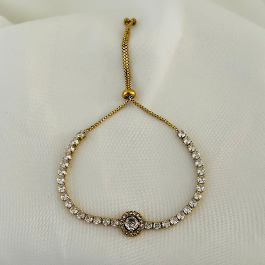 Adjustable gold bracelet with round crystal center