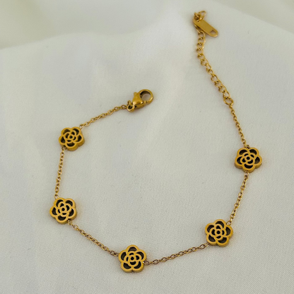Gold bracelet with flower-shaped charms